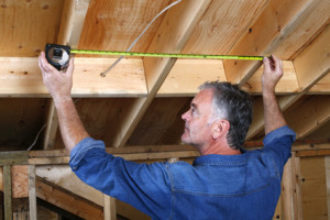 Mature man doing home renovations.